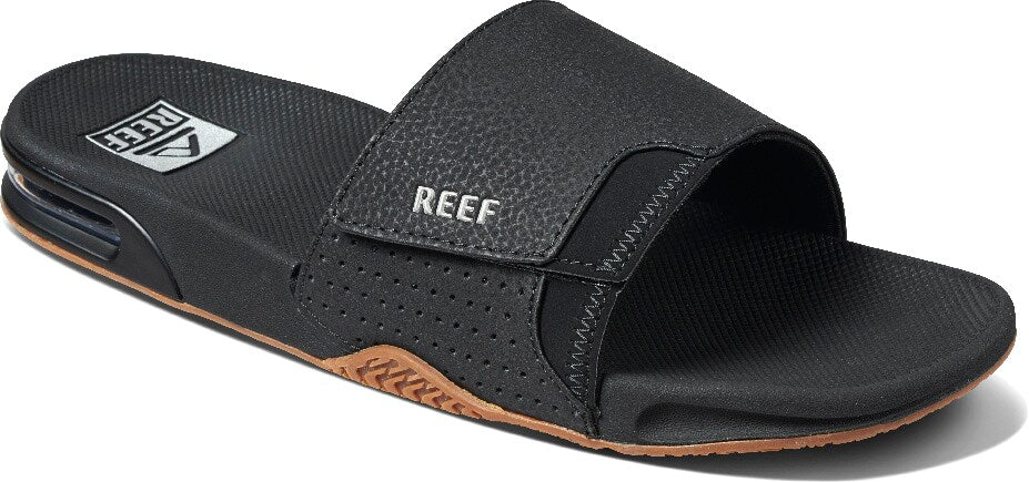 https://www.milosnowandskate.com/cdn/shop/products/reef-fanning-slide-sandals-black-silver-21_927x.jpg?v=1618349132